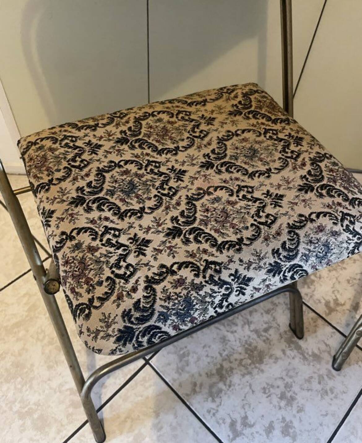 Two antique Manufrance folding chairs in metal and fabric