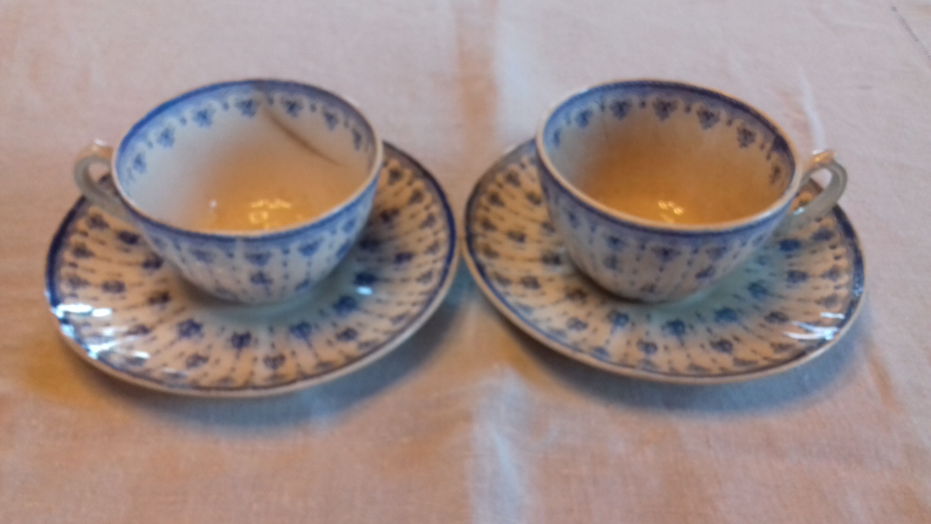 2 old coffee cups with their saucer, with blue bee patterns