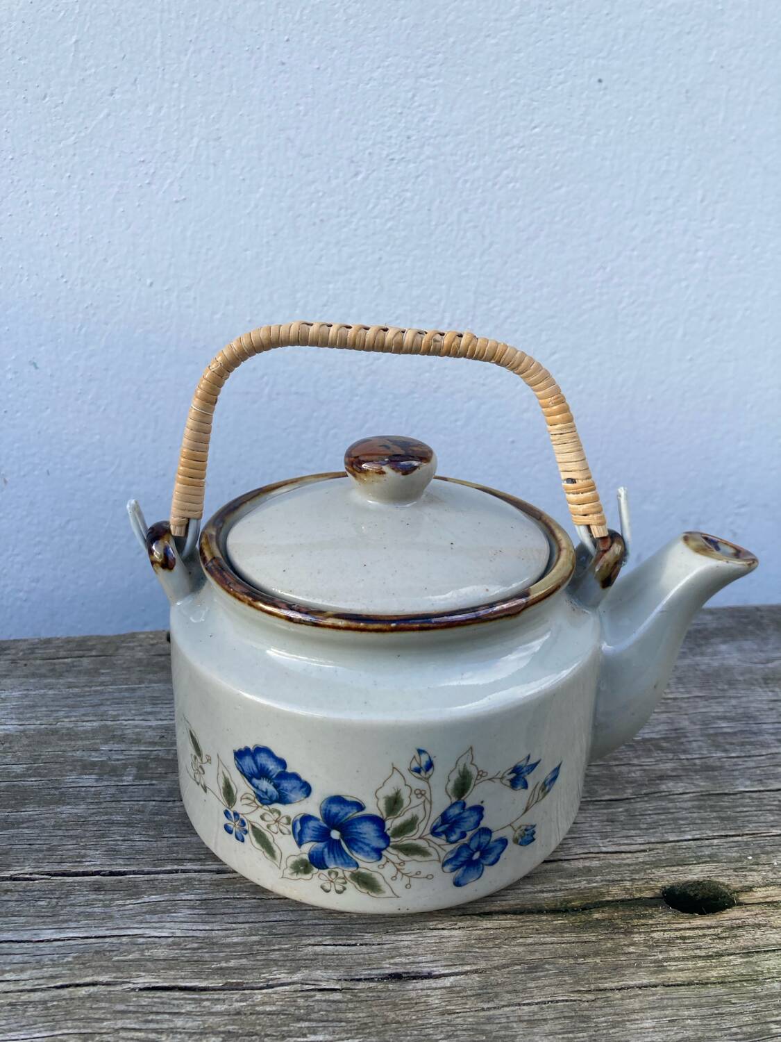Chinese ceramic and rattan teapot