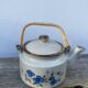 Chinese ceramic and rattan teapot