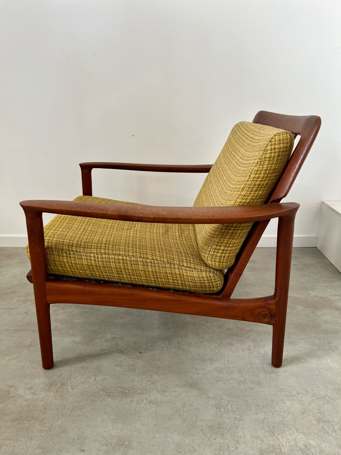 Old Scandinavian design armchair in vintage teak year 60