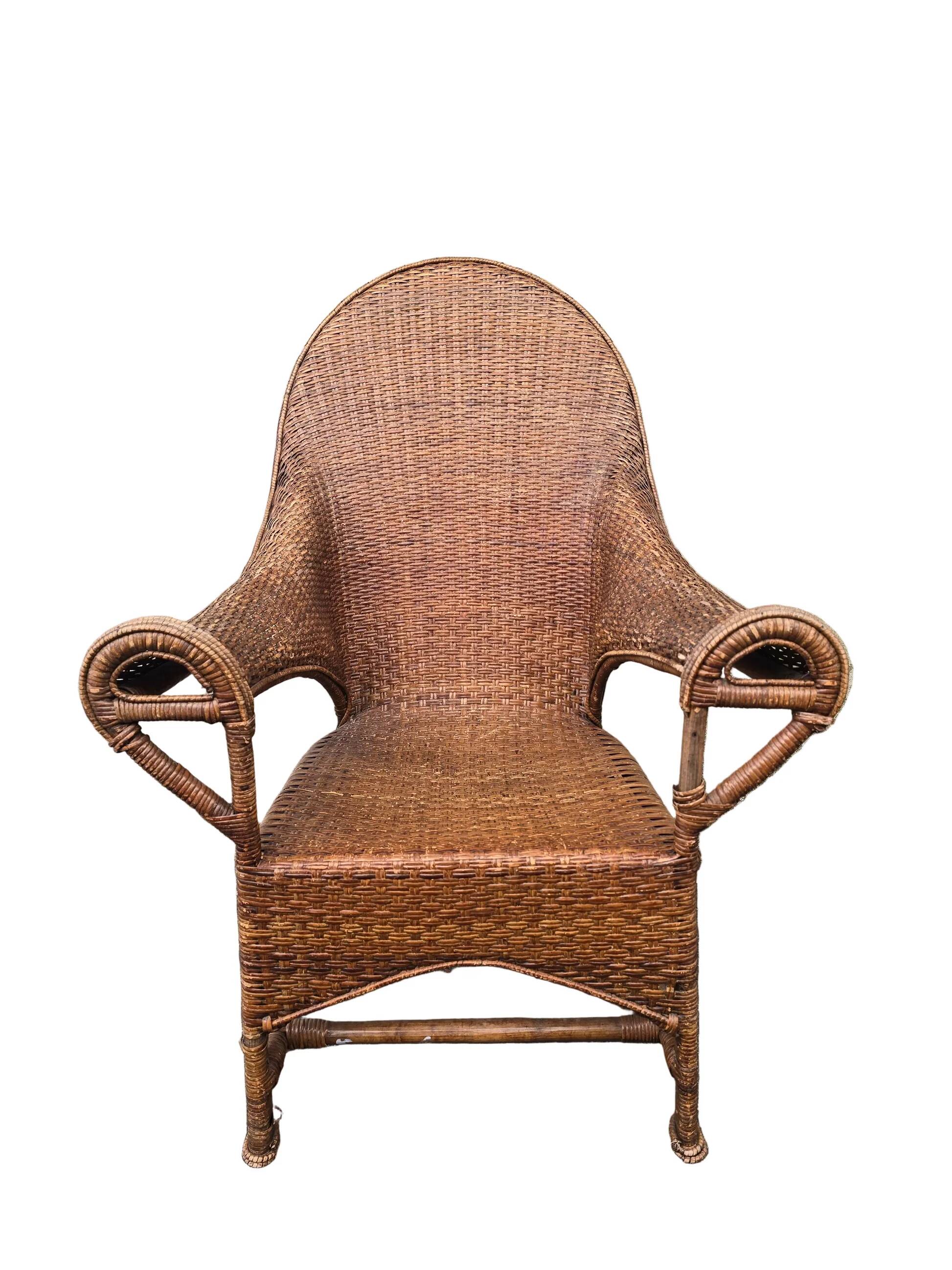 Arts & Crafts armchair in wicker and rattan attributed to Dryad & Co, UK, circa 1920.