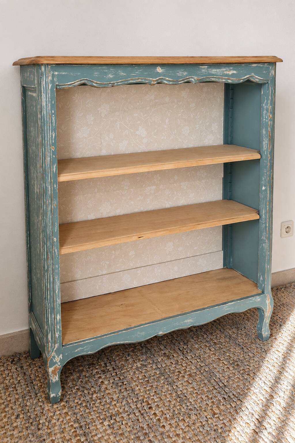 Antique wooden bookshelf with a patinated blue-green finish.