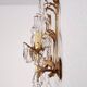 Hand-forged wall lamp gilded with gold leaf and crystals, Italy
