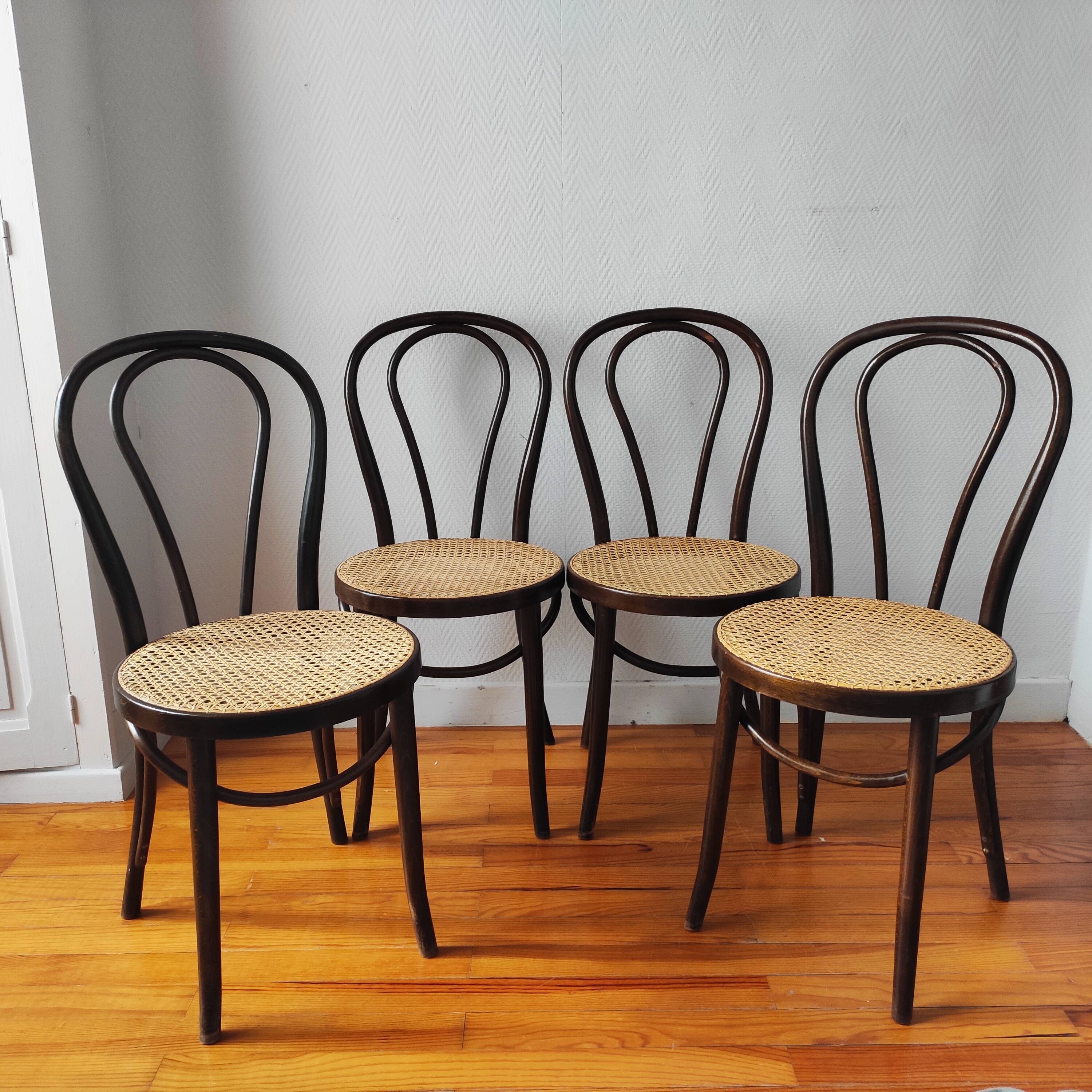 4 antique curved wood and cane chairs