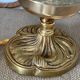 Textured round globe table lamp with a gold brass base