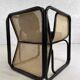 Cubic armchair in black rattan and canework