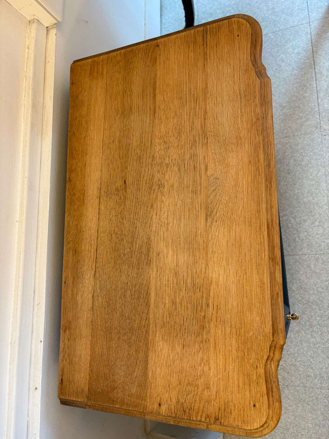 Mat black storage furniture, natural top.