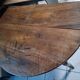 Oval table with folding leaves