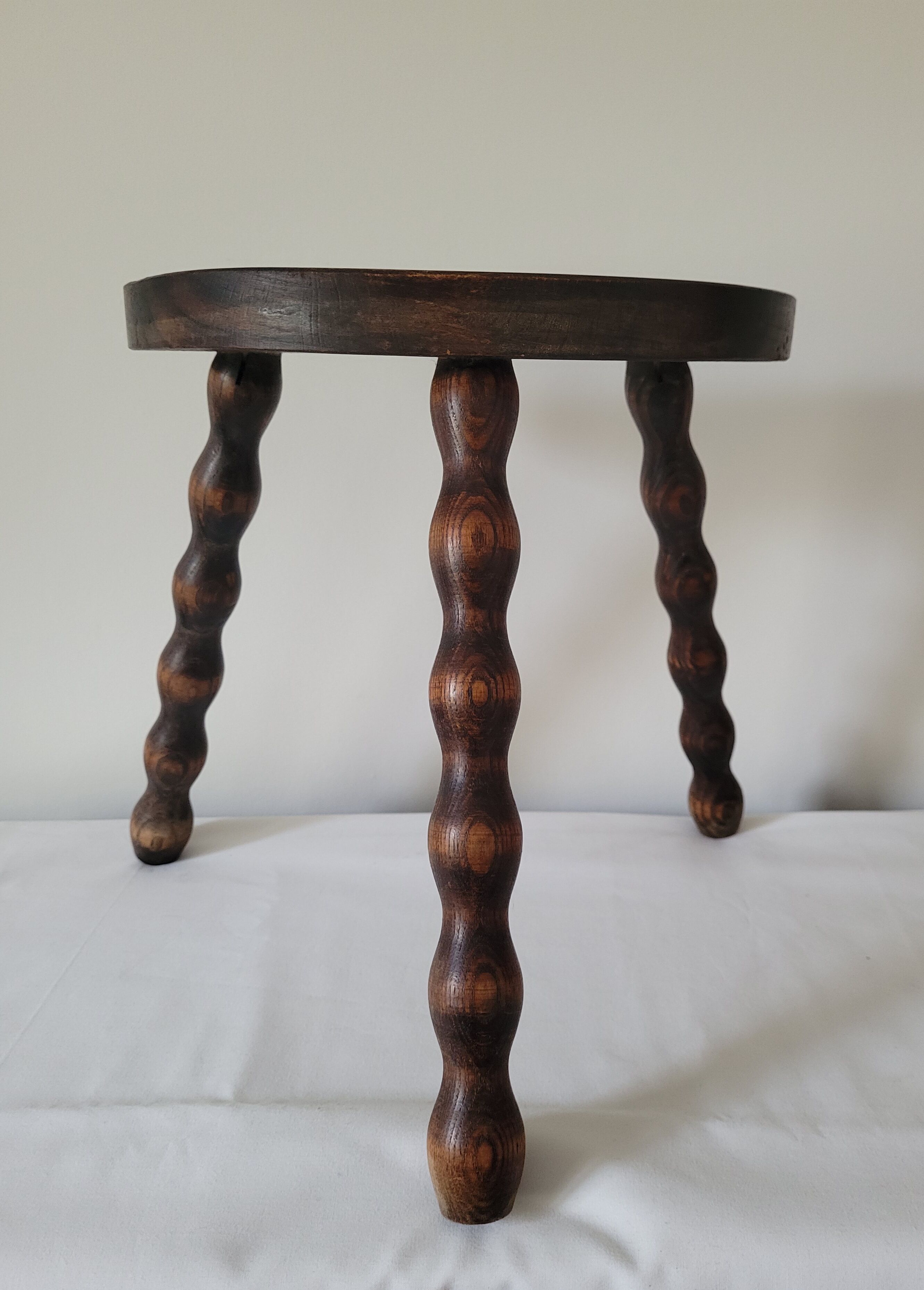 Tripod stool with turned wooden legs