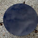 Table basse plateau verre noir et pompons bronze doré