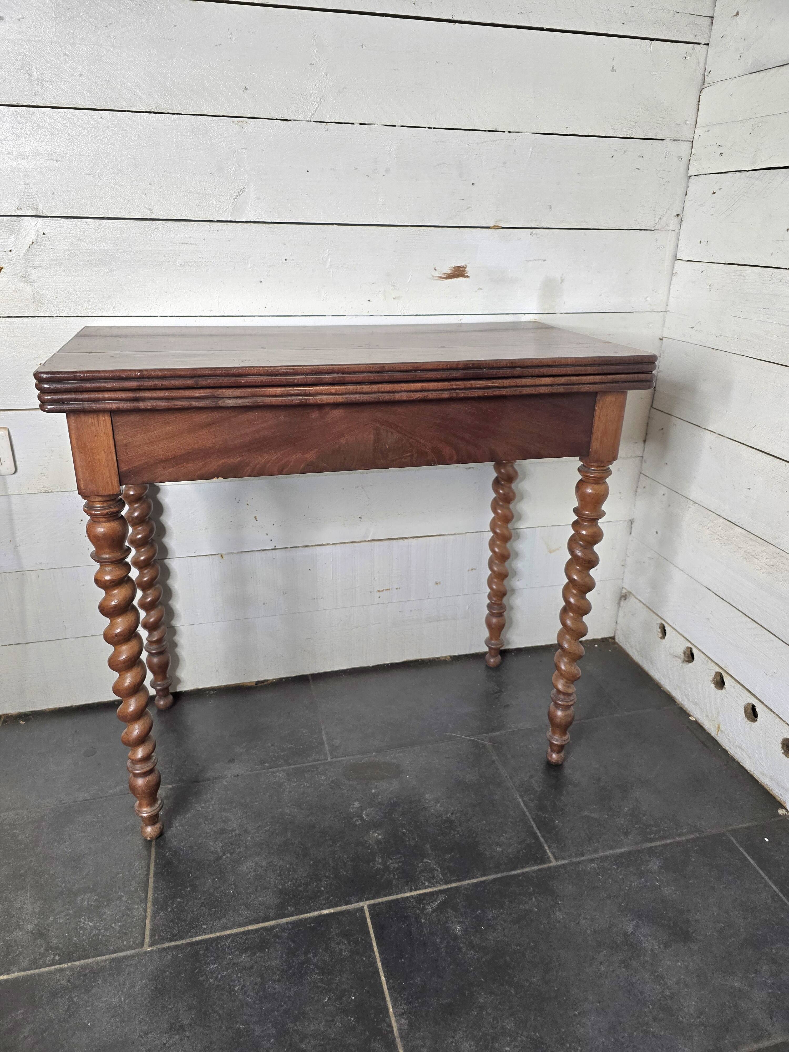 Old mahogany game table