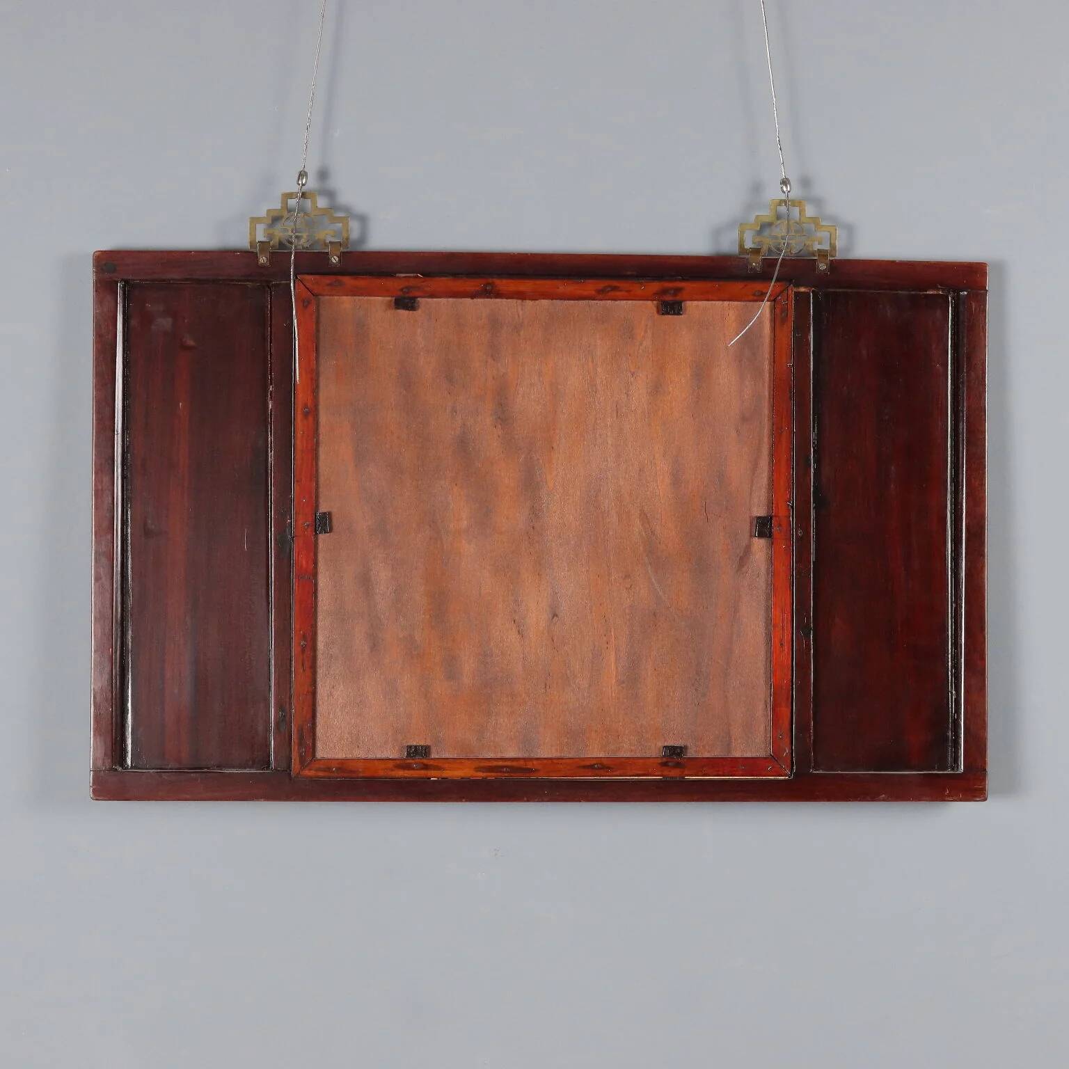 Antique mirror in exotic wood with chinoiserie carvings, 19th century.