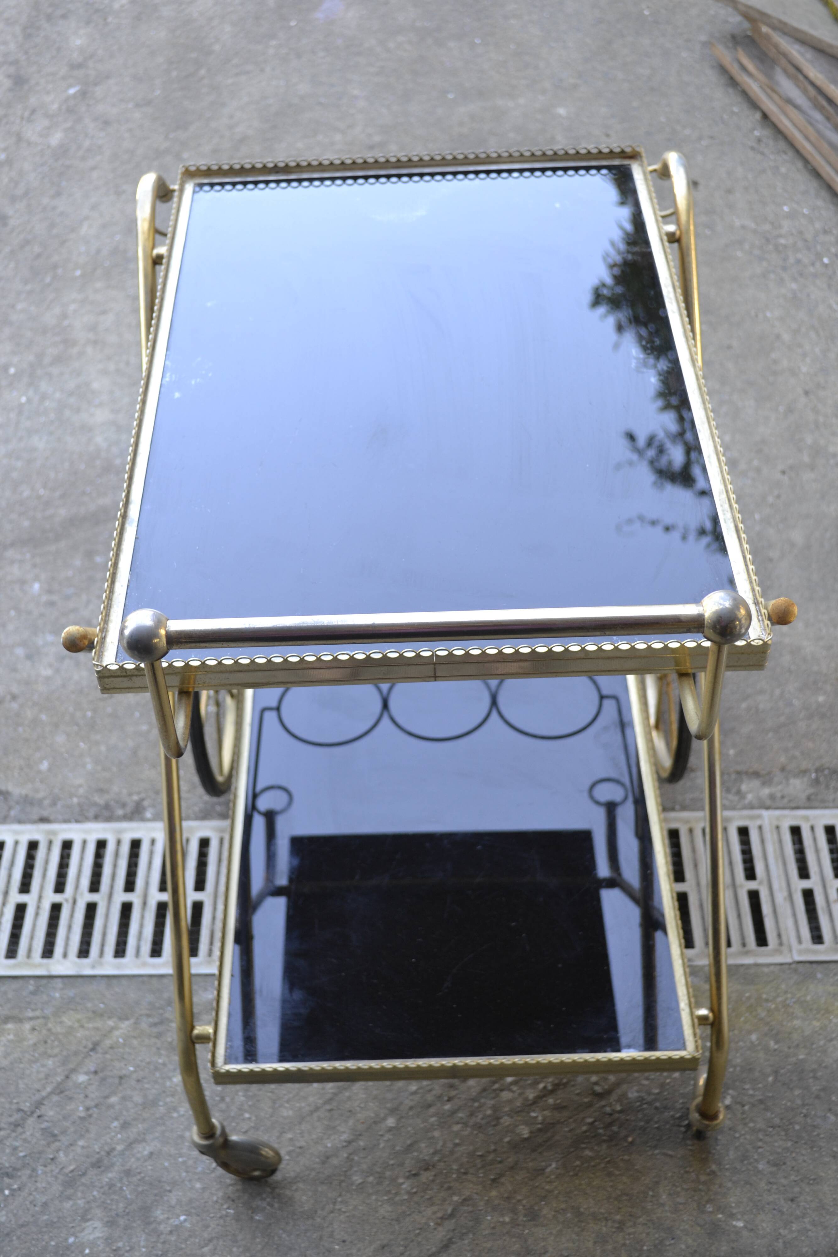 Rolling cart in brass and smoked glass