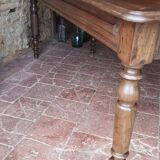 Old French farmhouse table in walnut with turned legs.
