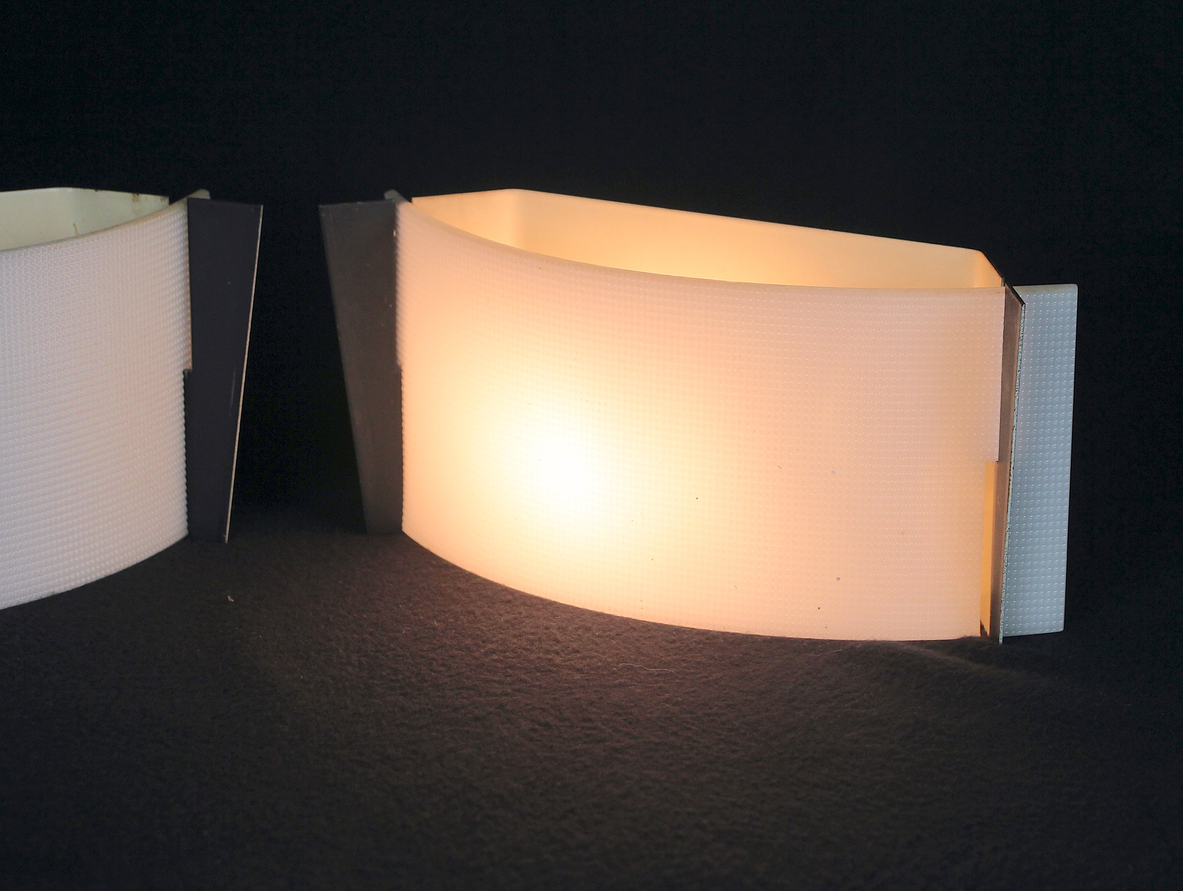 Pair of mid-century wall lamps in black metal and perspex, france