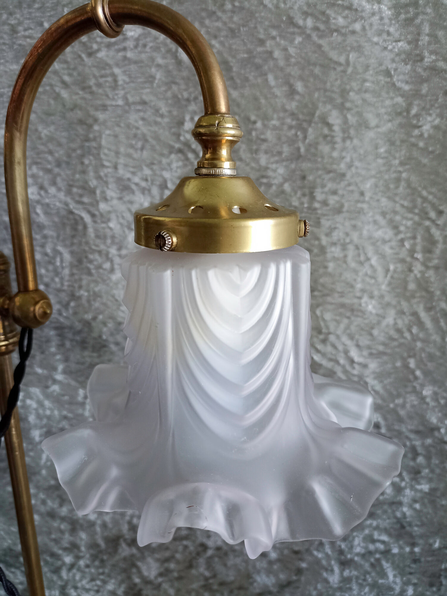 Adjustable brass desk lamp with frosted glass tulip