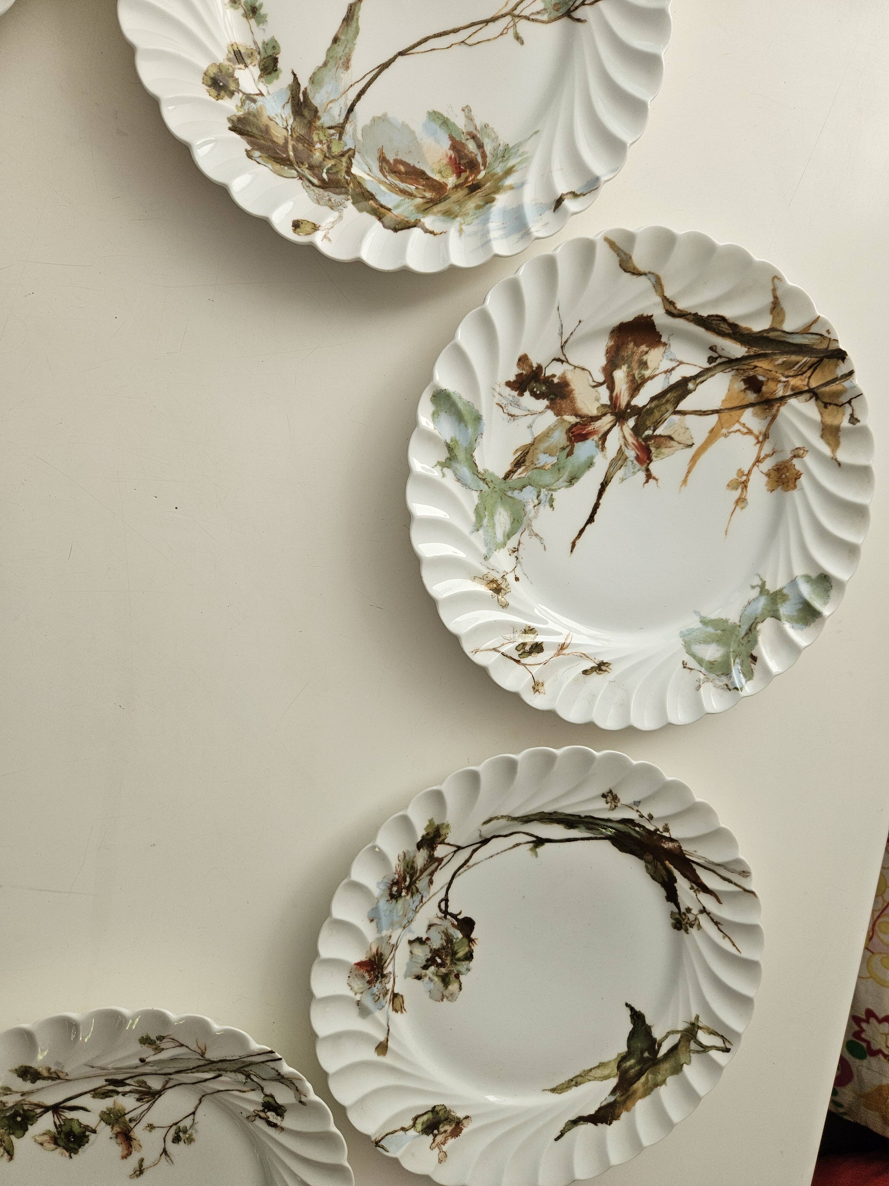 Haviland service plates, dishes on pedestals and soup tureen