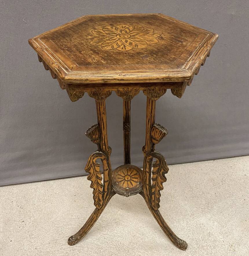Carved wooden pedestal table