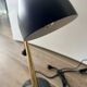 Eichholtz Cordero desk lamp in brass, black metal and marble.