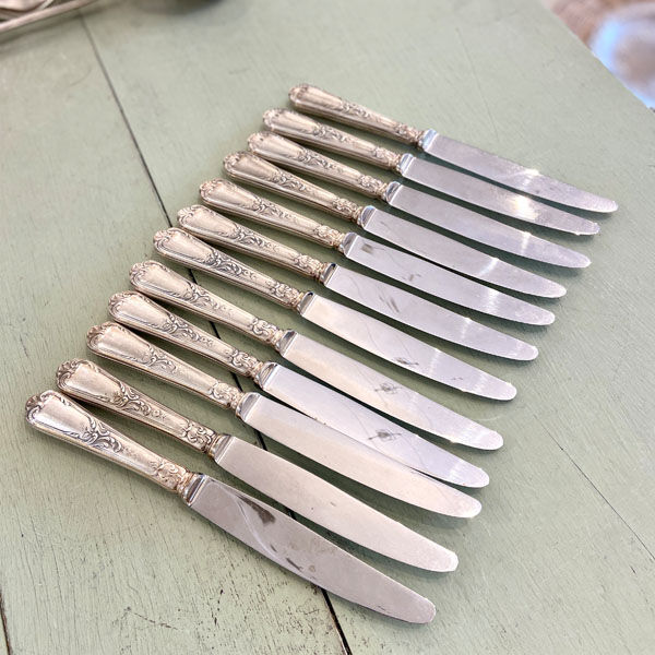 Series of 12 silver metal table knives, Ercuis Goldsmith
