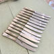 Series of 12 silver metal table knives, Ercuis Goldsmith
