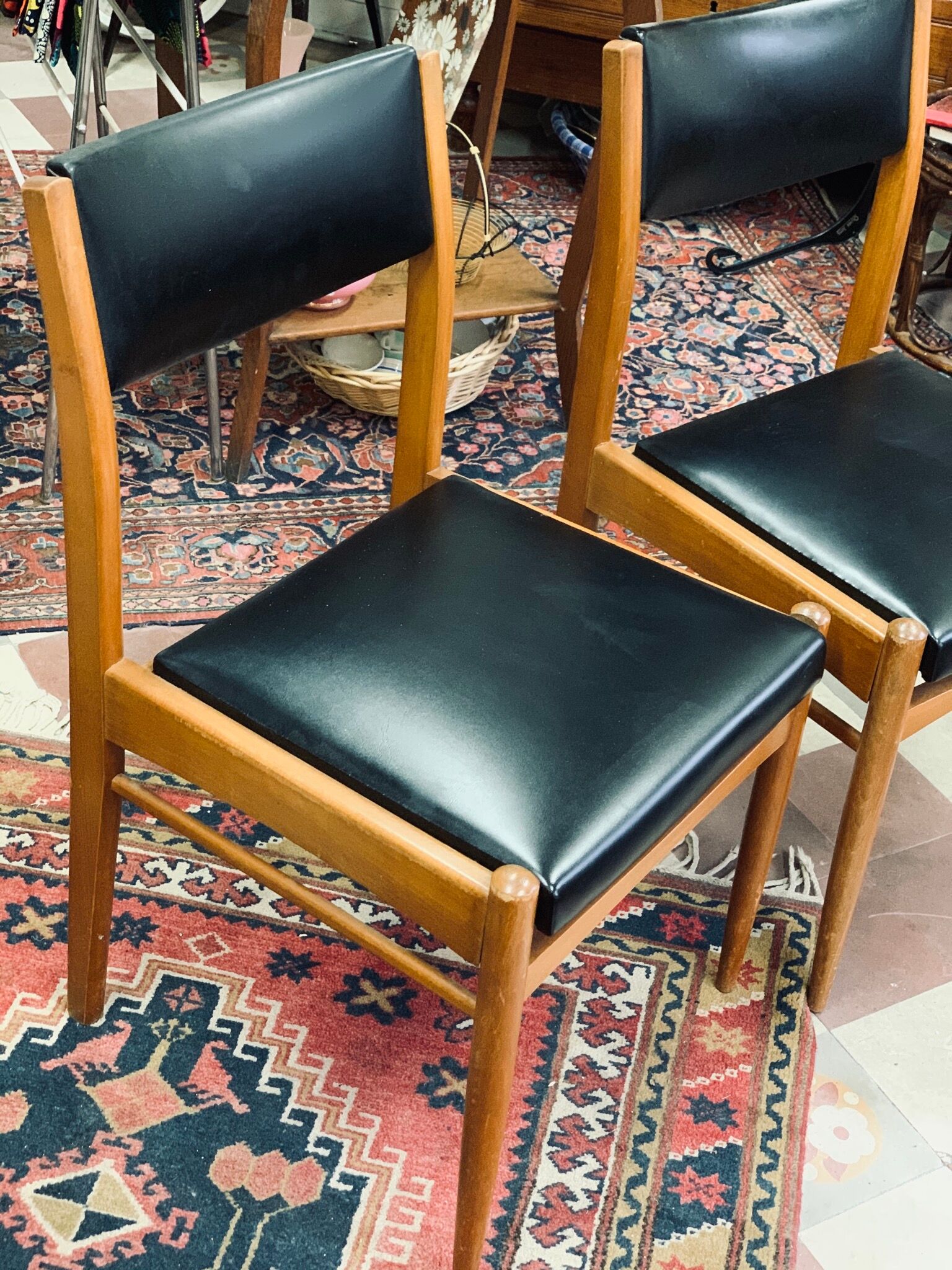 2 Scandinavian-style natural wood chairs, black trim