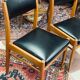 2 Scandinavian-style natural wood chairs, black trim
