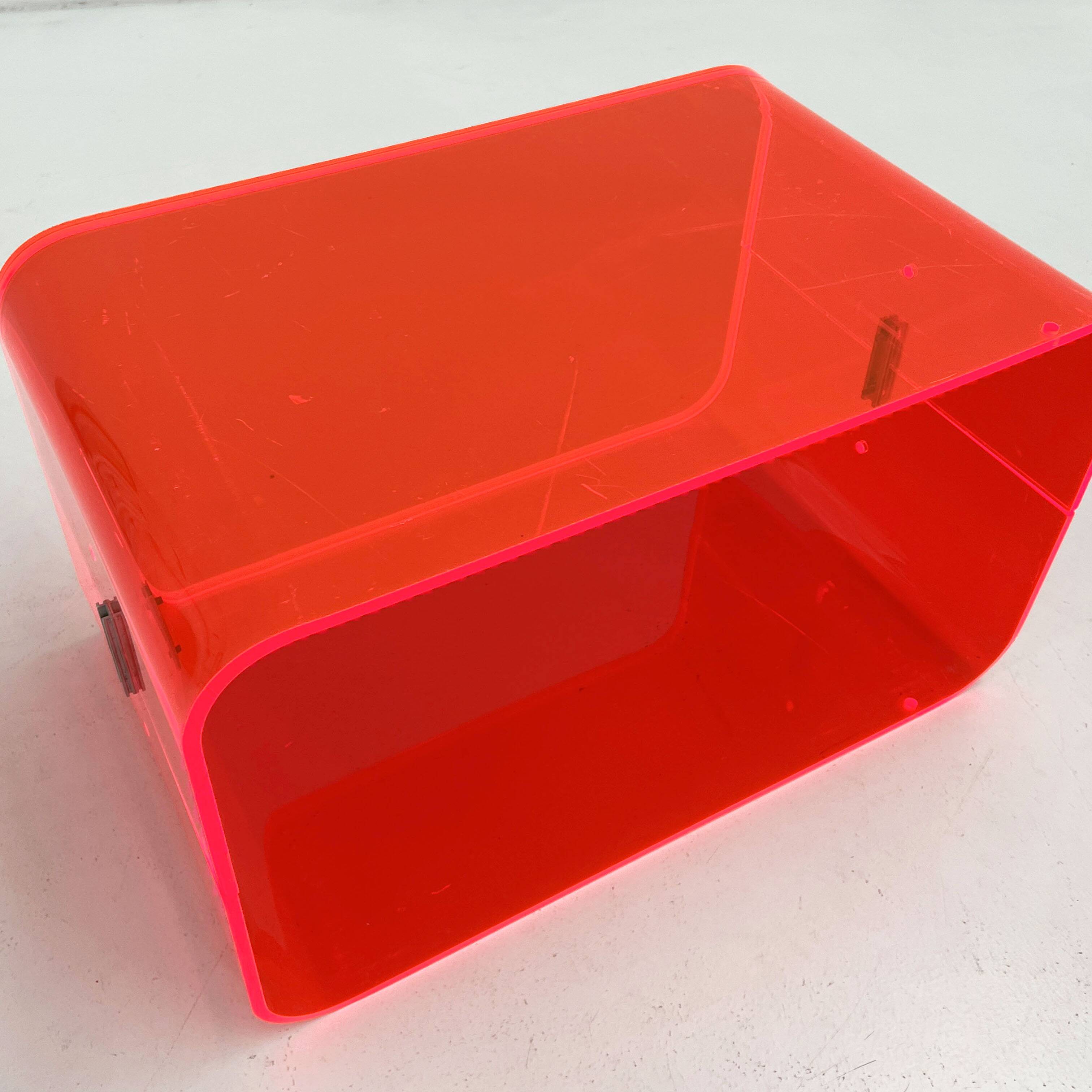 Fluorescent pink plexiglass coffee table, 1980.