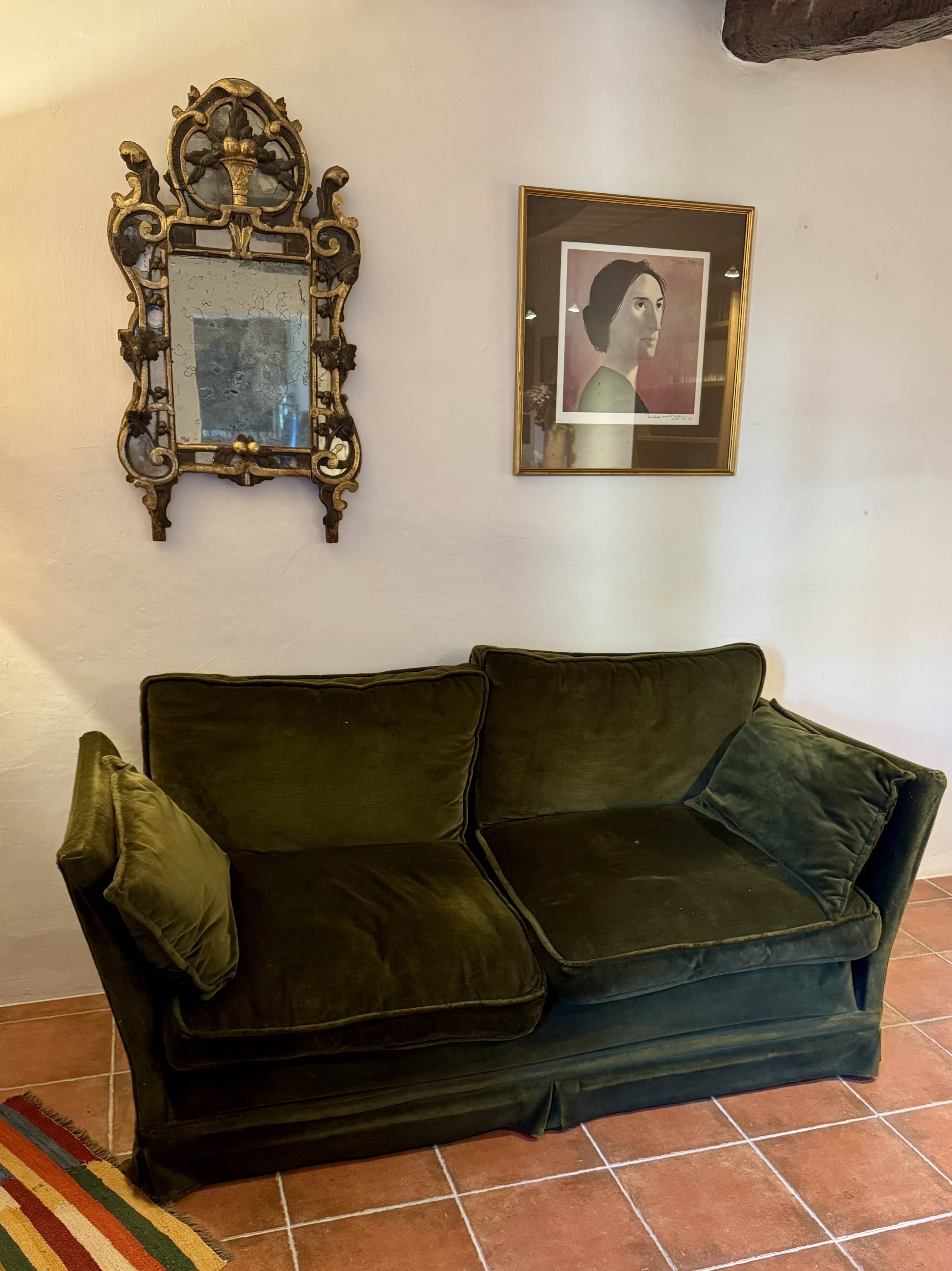 Antique green velvet sofa