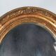 Antique oval mirror with original stucco and gilt wood frame, 37x31 cm. Beautiful patina.