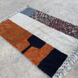 Handmade wool rug in colourful patterns, size 150x250 cm.