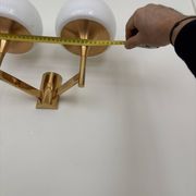 Golden metal wall light and opaline, 1970