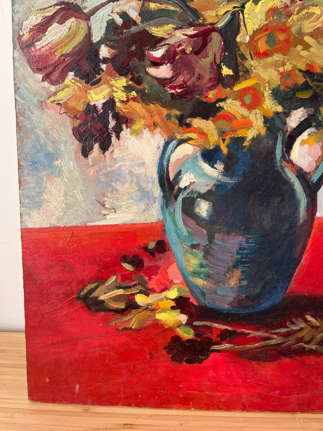 Bouquet of flowers on a red tablecloth, knife on a board, signed Renzo.