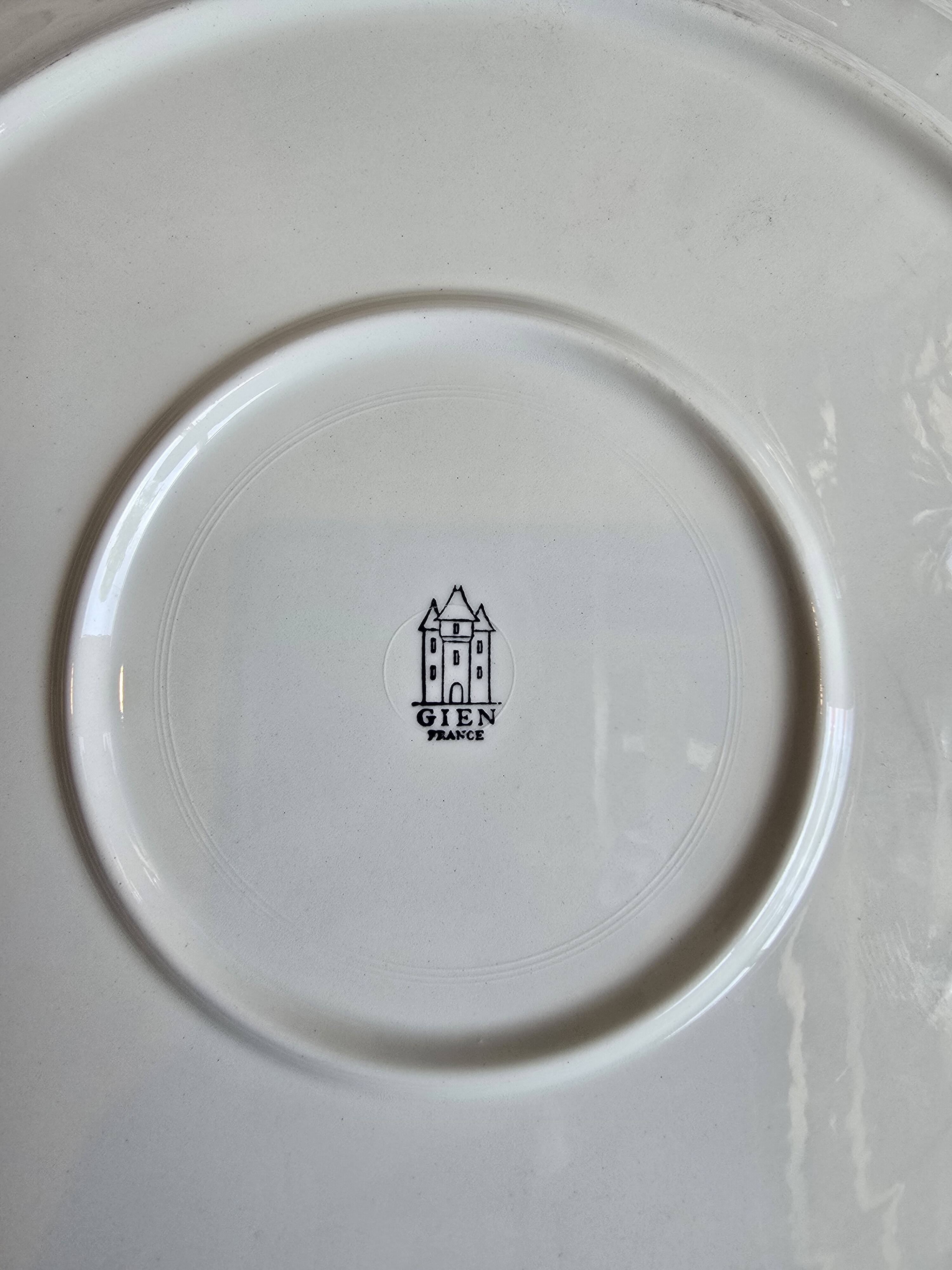 Oval dish in Gien France earthenware, green flower decoration, relief woven edge.