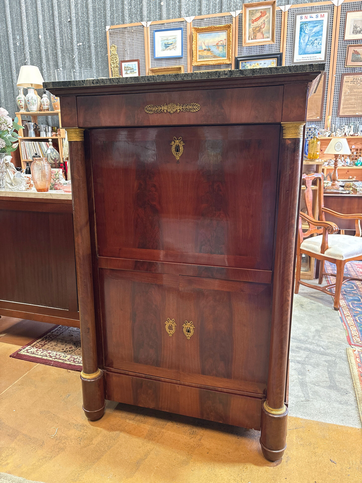 Empire secretary in mahogany, bronze and marble with secret drawers.