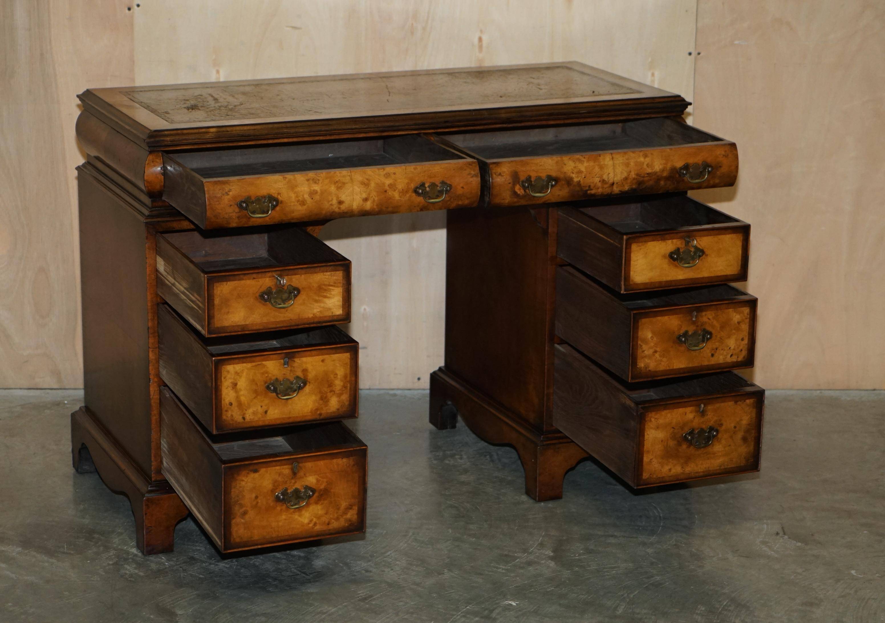 Victorian antique partner's desk in veined walnut with a leather top.