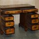 Victorian antique partner's desk in veined walnut with a leather top.