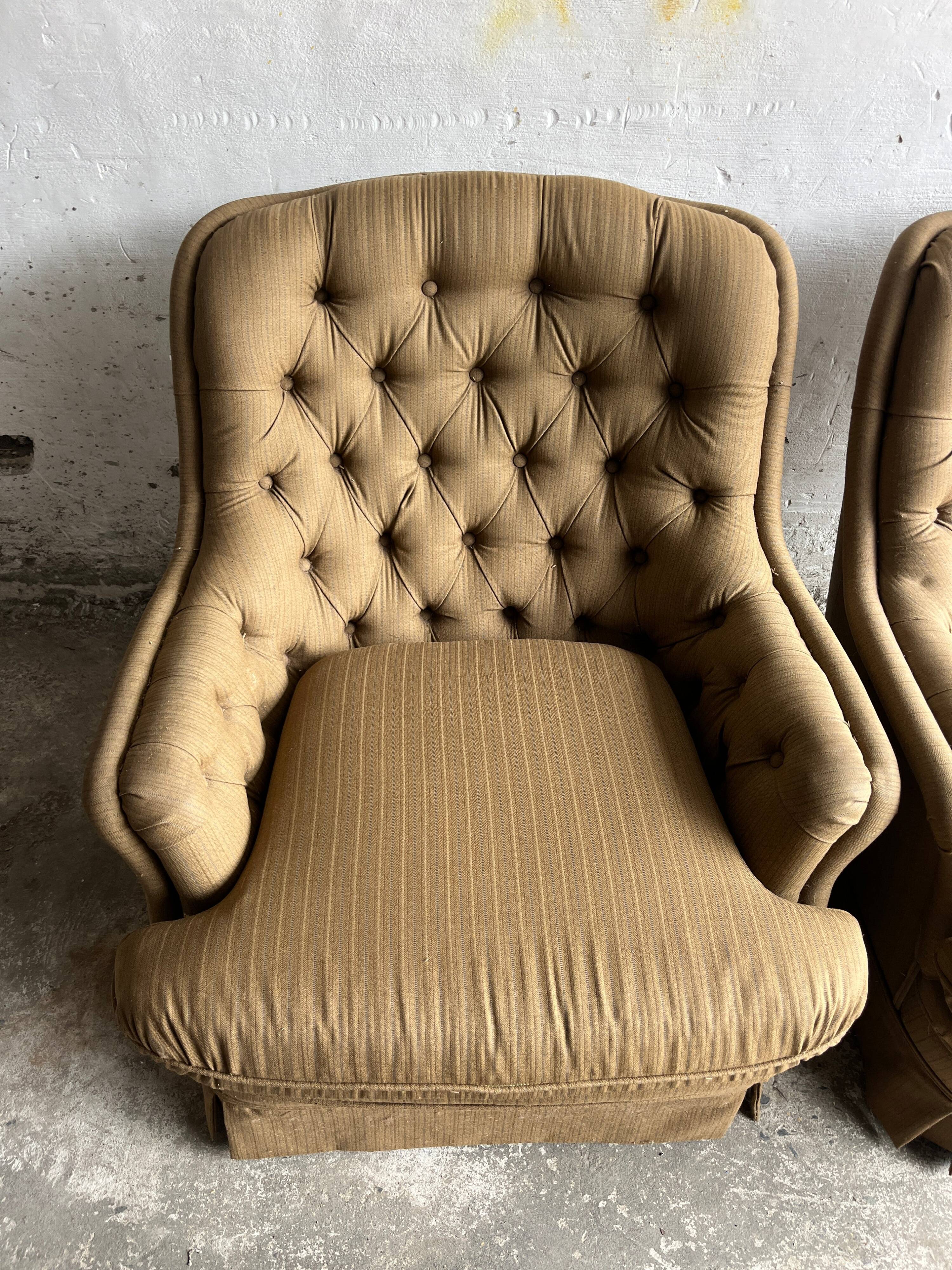 Pair of upholstered lounge chairs with ottoman, 1970s