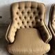 Pair of upholstered lounge chairs with ottoman, 1970s