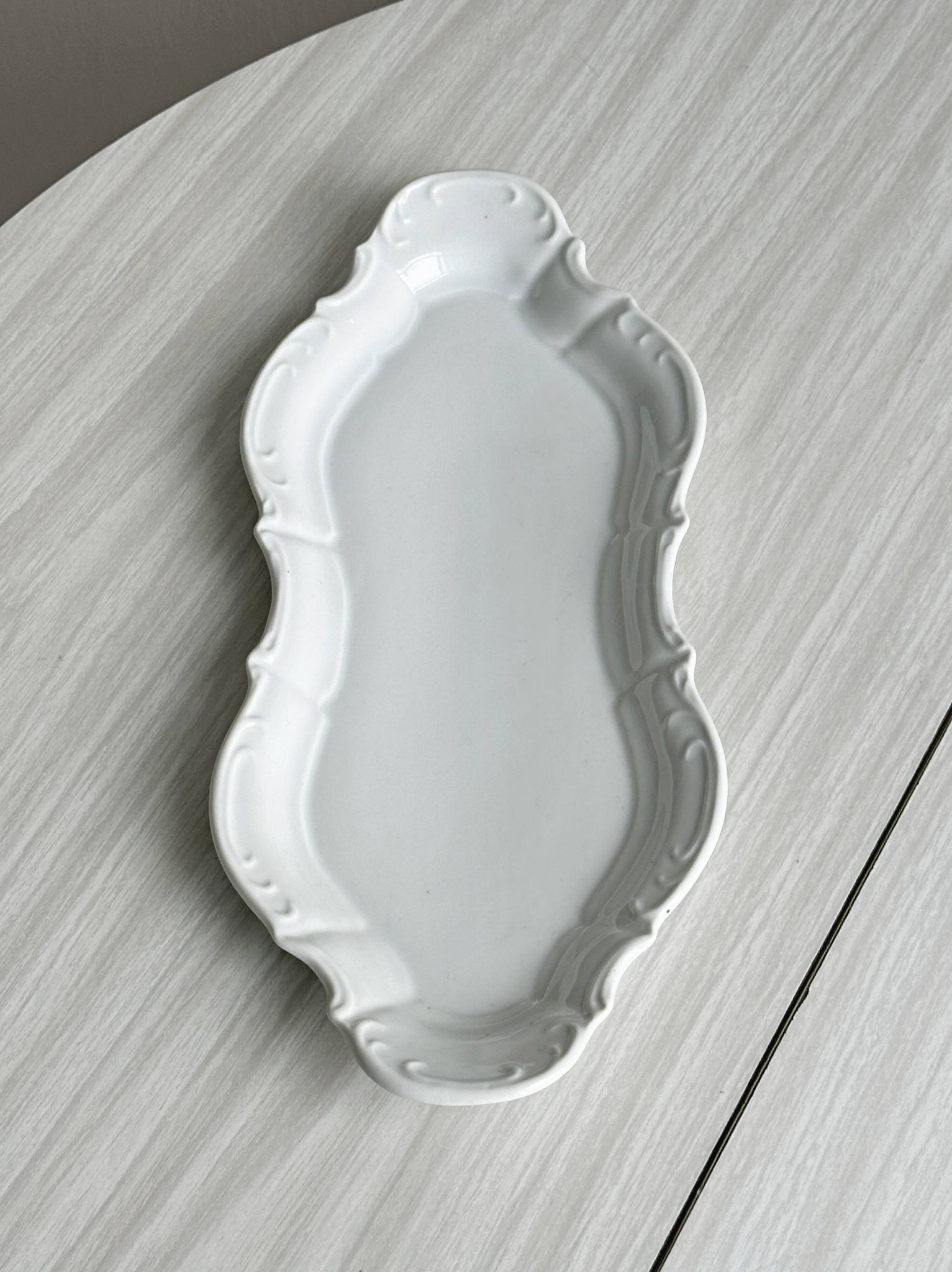 white porcelain plate in an unusual shape