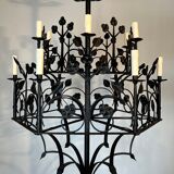 Lustre with 12 lights in wrought iron decorated with clovers and foliage.