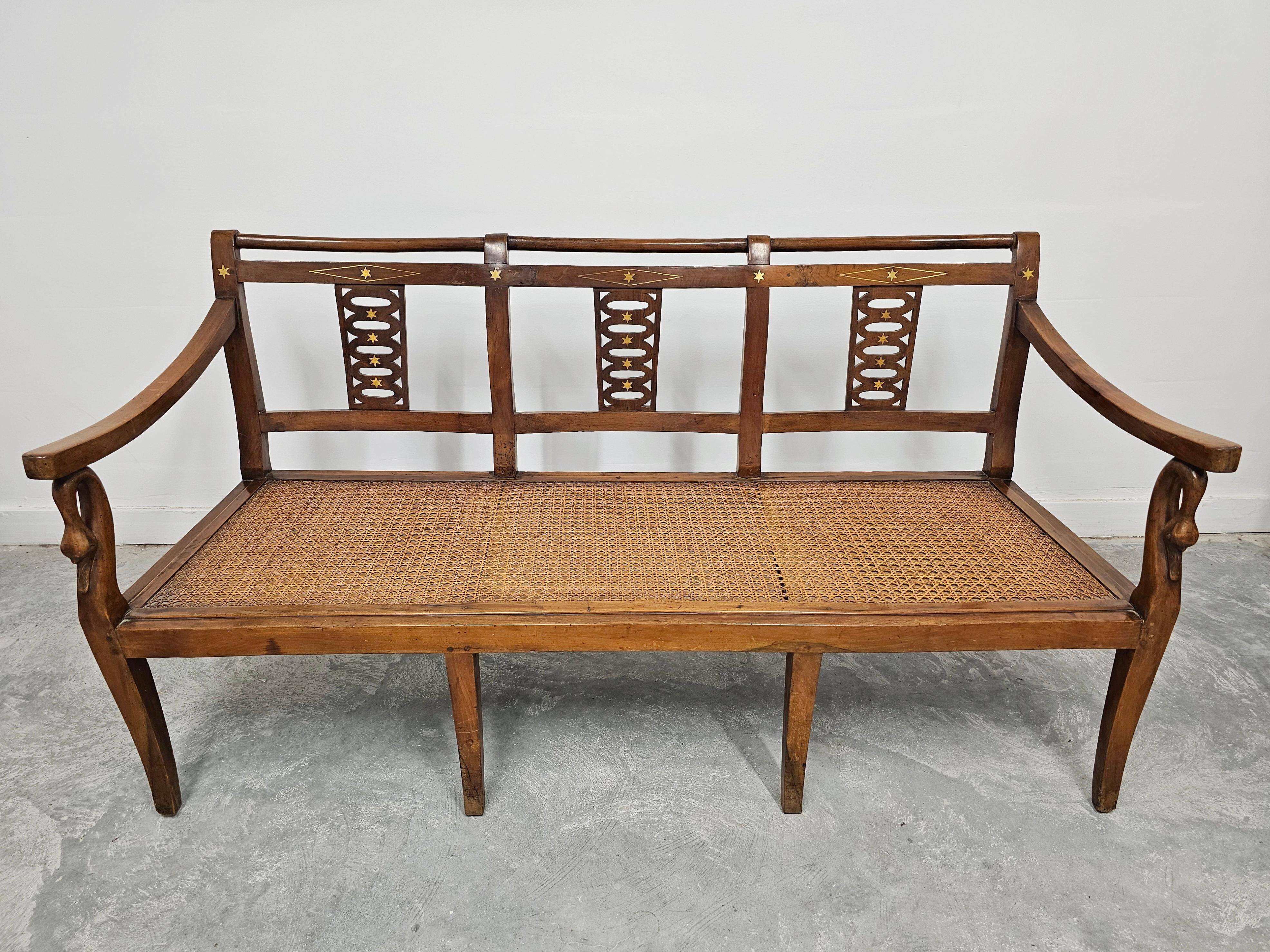 Directoire canapé in walnut with brass inlays, late 18th century.
