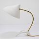 White brass desk or table lamp in the Louis Kalff style from the 1950s.