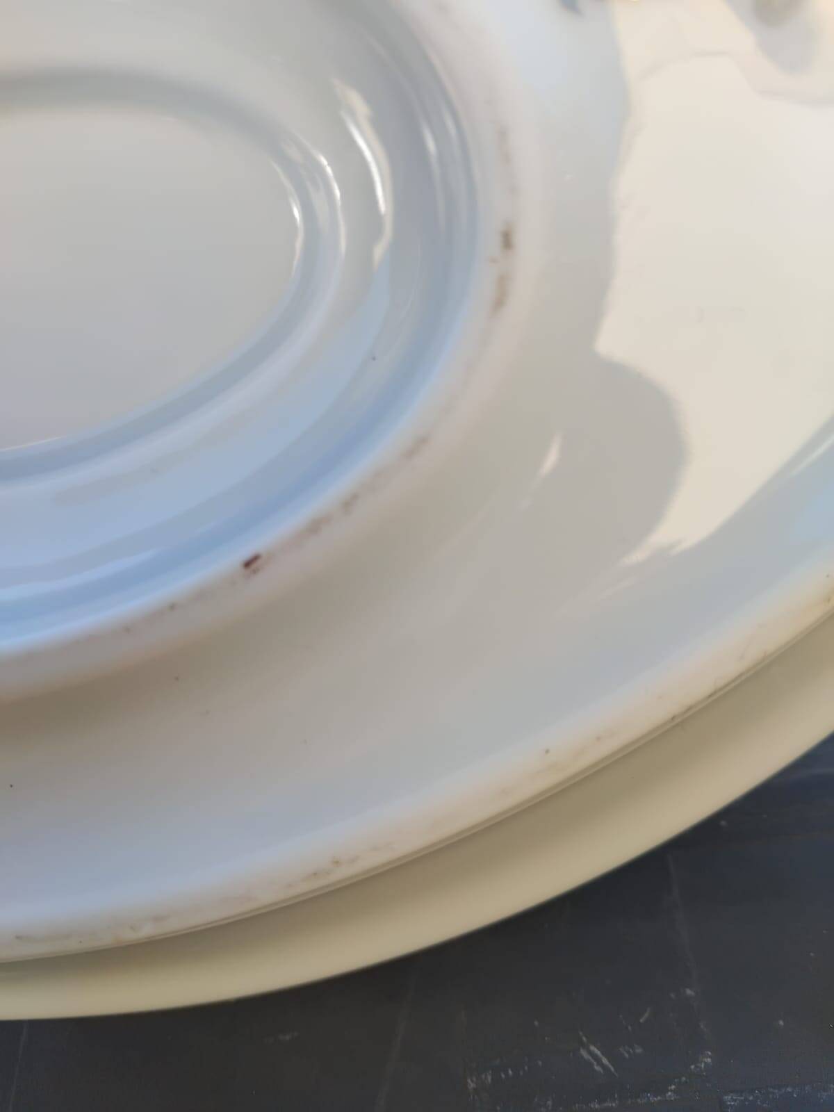 Vintage fine porcelain sauce boat with gold gilding.