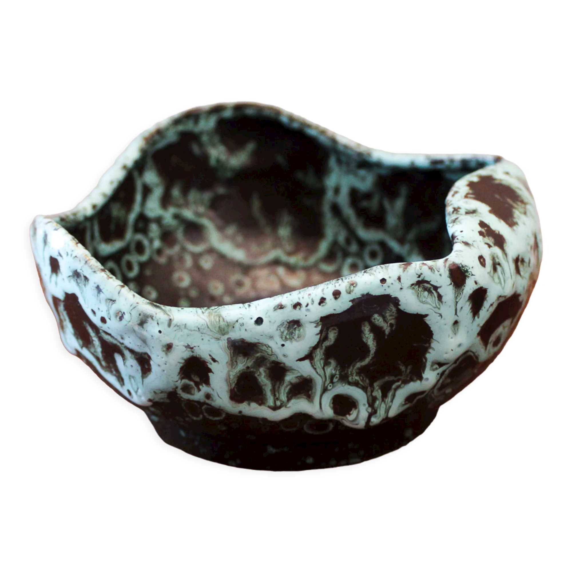 Empty pocket in black ceramic with green drip