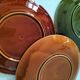 Set of green and amber enamelled plates