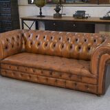 Fawn-colored tufted Chesterfield sofa