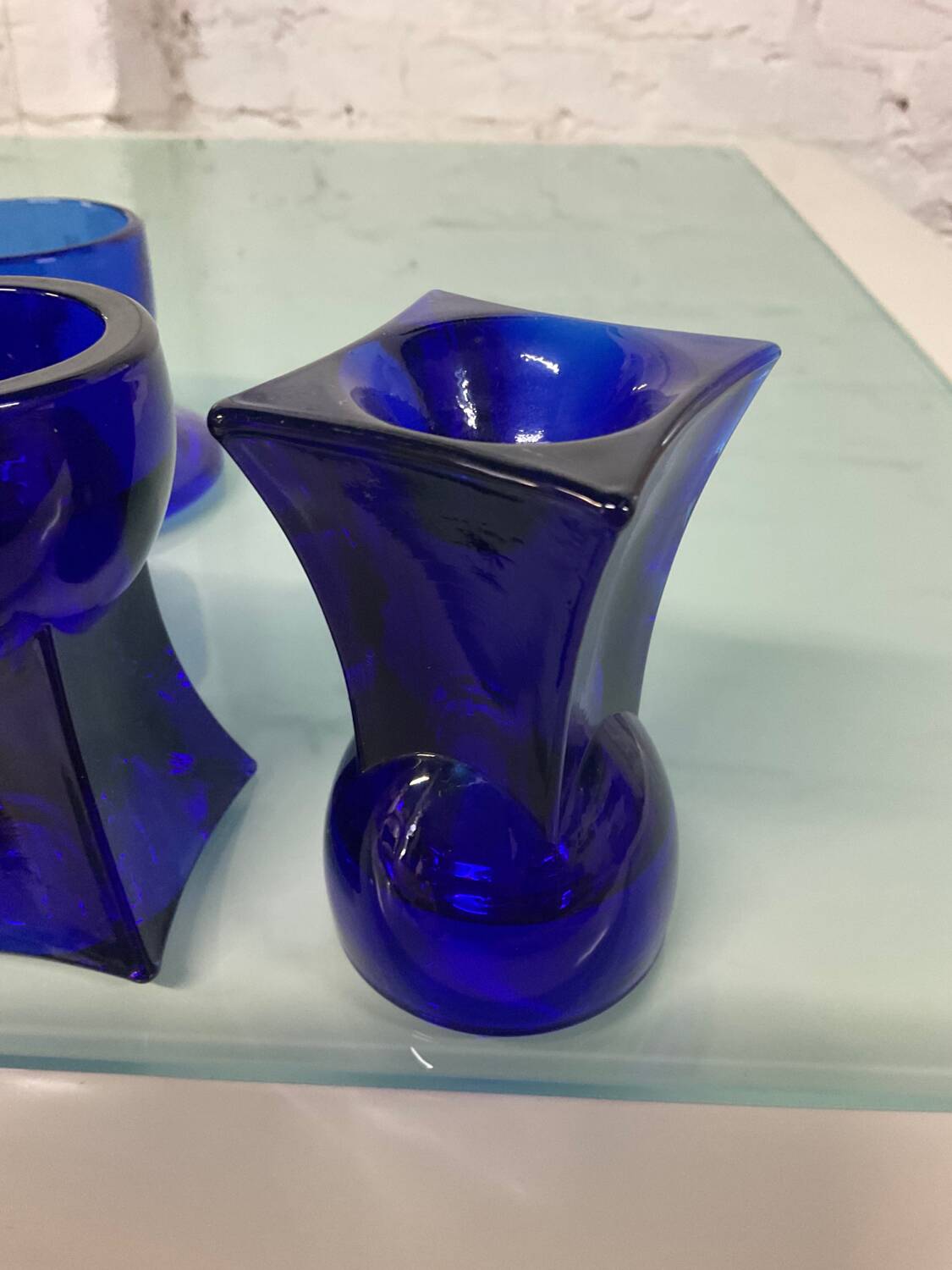 Set of 7 vintage cobalt blue glass footed candlesticks
