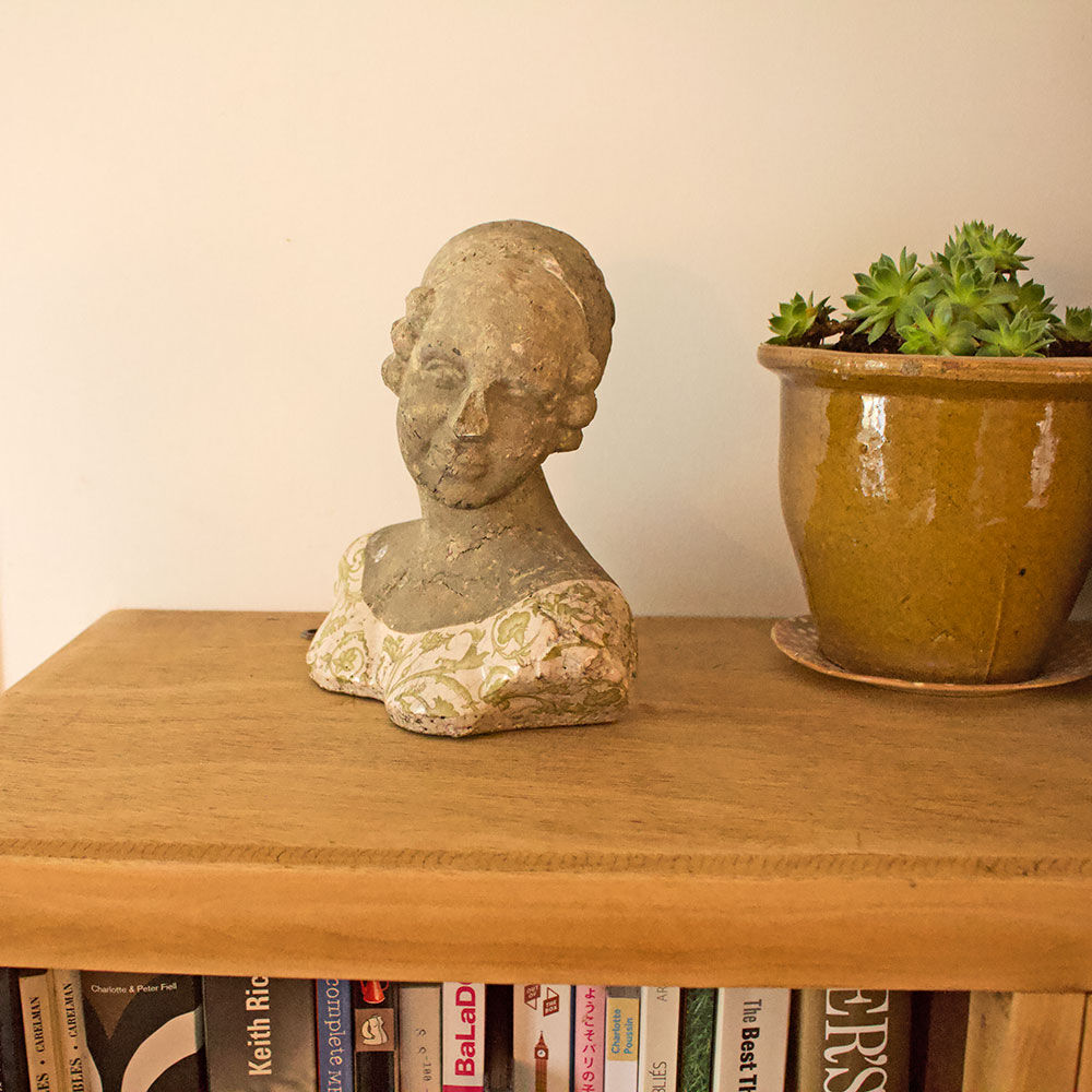 Woman bust in stone and enamel